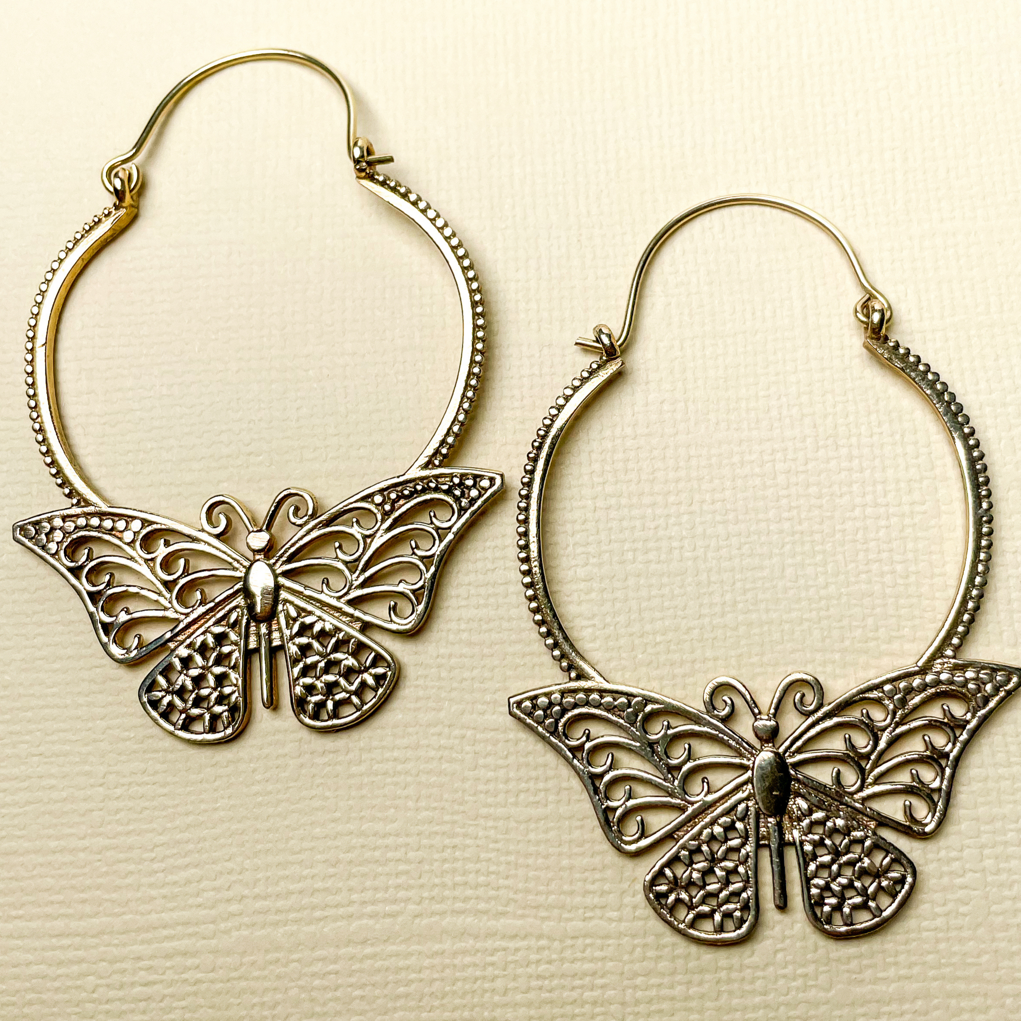 Trendy GoldToned Butterfly Studded Metallic Hoop Earrings